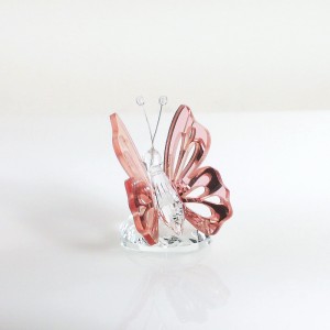 Farfalla su base plex rosegold e cristallo